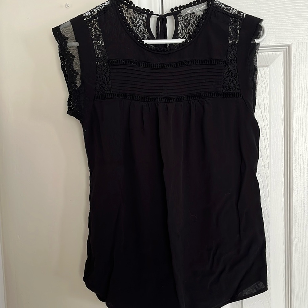 Daniel Rainn black sleeveless top.
